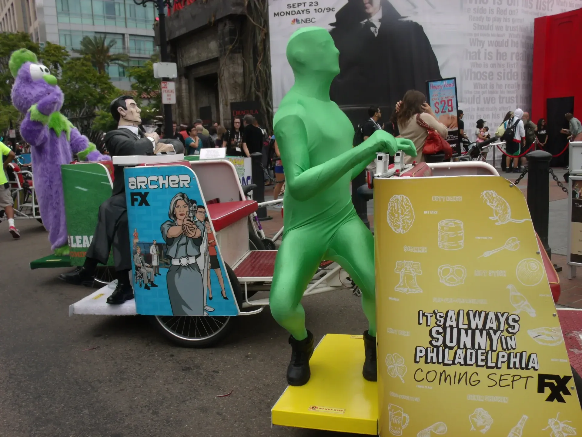 Archer FX and Always Sunny Green Man branded pedicabs at Comic-Con