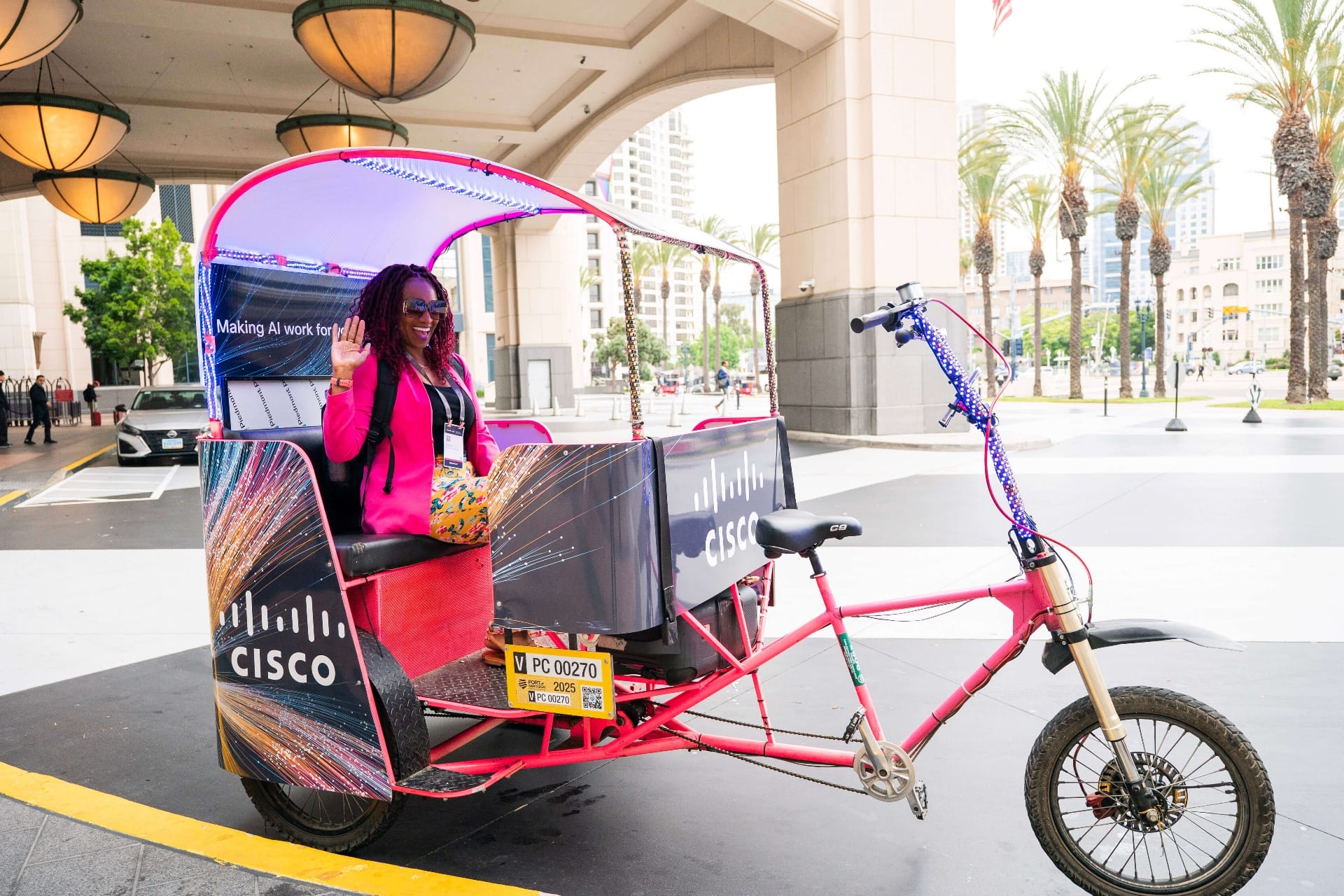 Happy passengers in Cisco pedicab at San Diego Convention Center