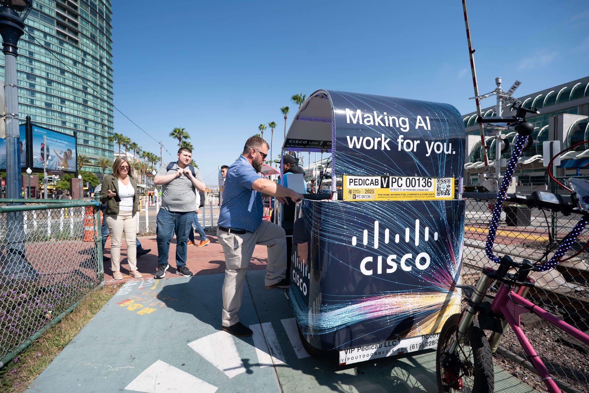 Branded pedicab advertising for IADR 2026 at San Diego Convention Center