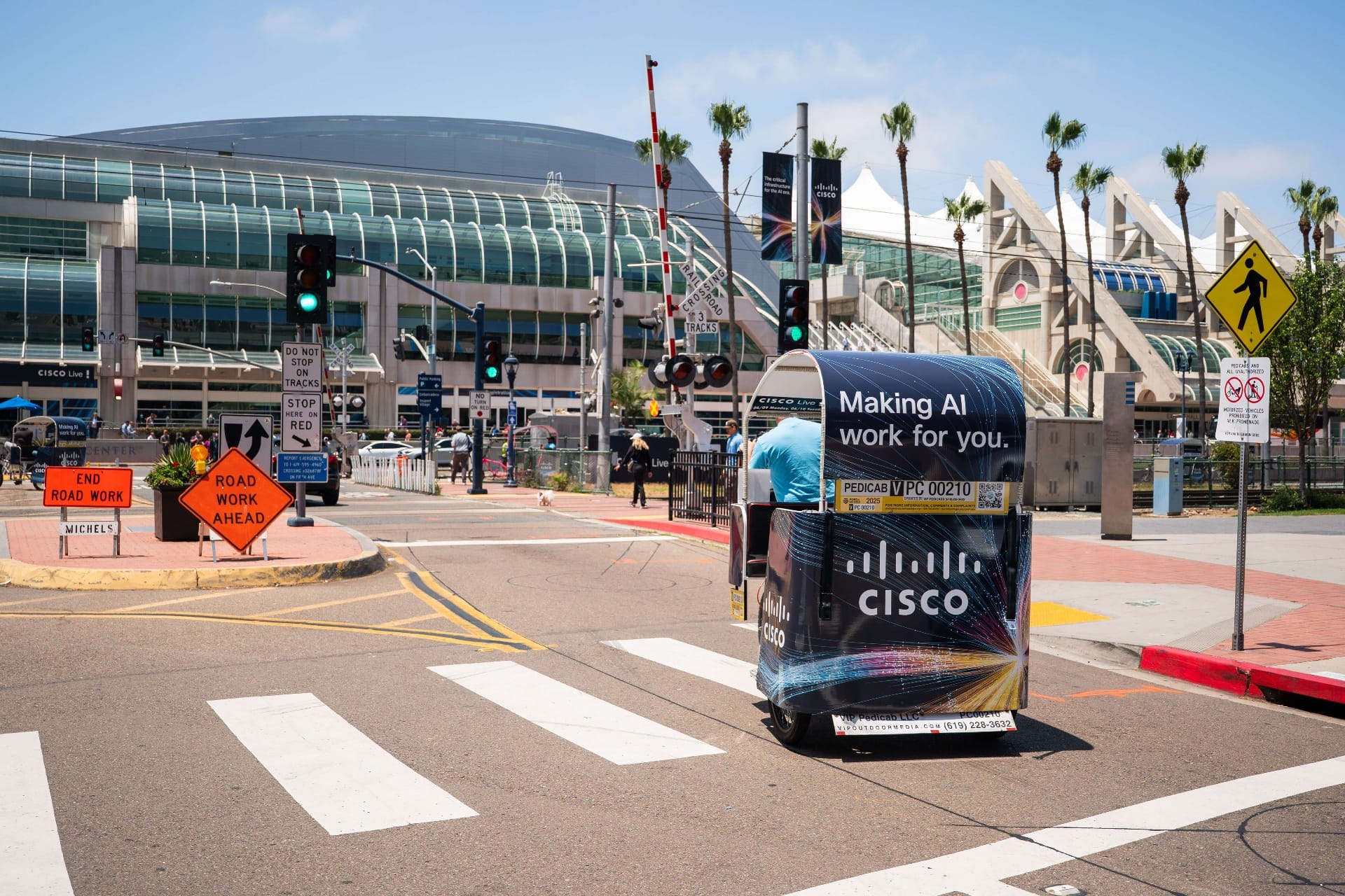 Closeup of Cisco branded pedicab wrap in downtown San Diego