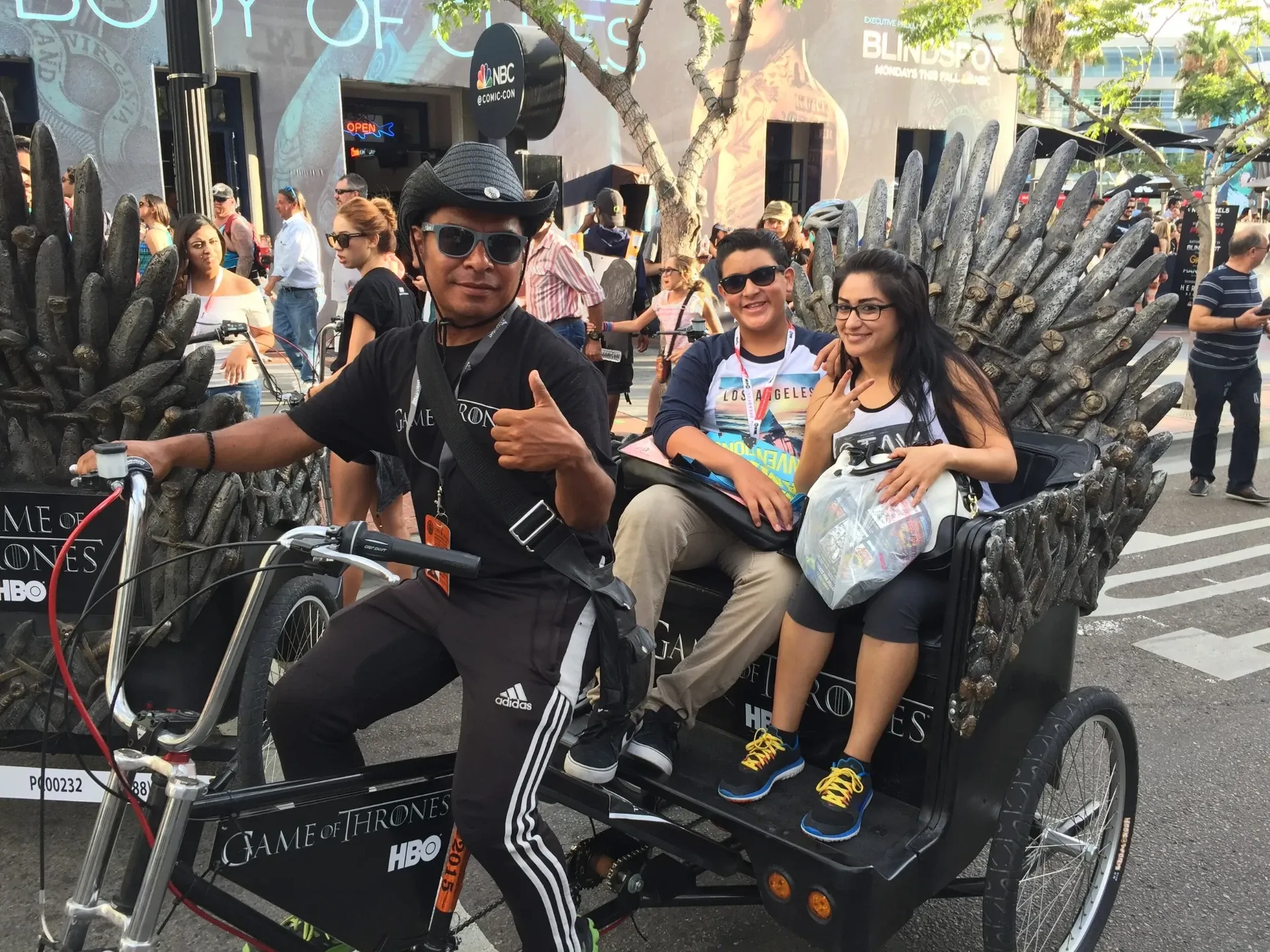 Game of Thrones HBO pedicab driver giving thumbs up with passengers at Comic-Con