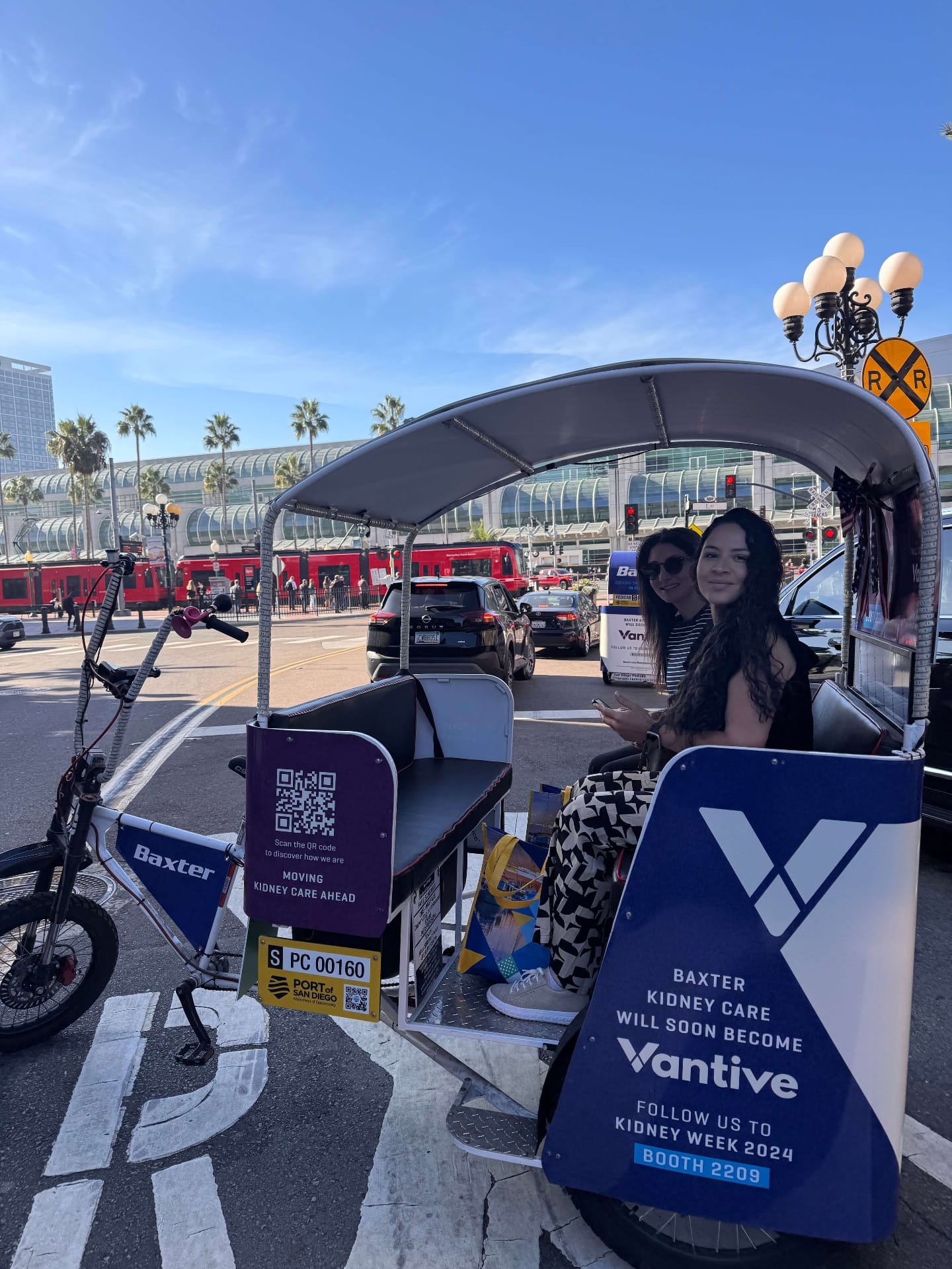 Happy passengers enjoying pedicab ride in San Diego