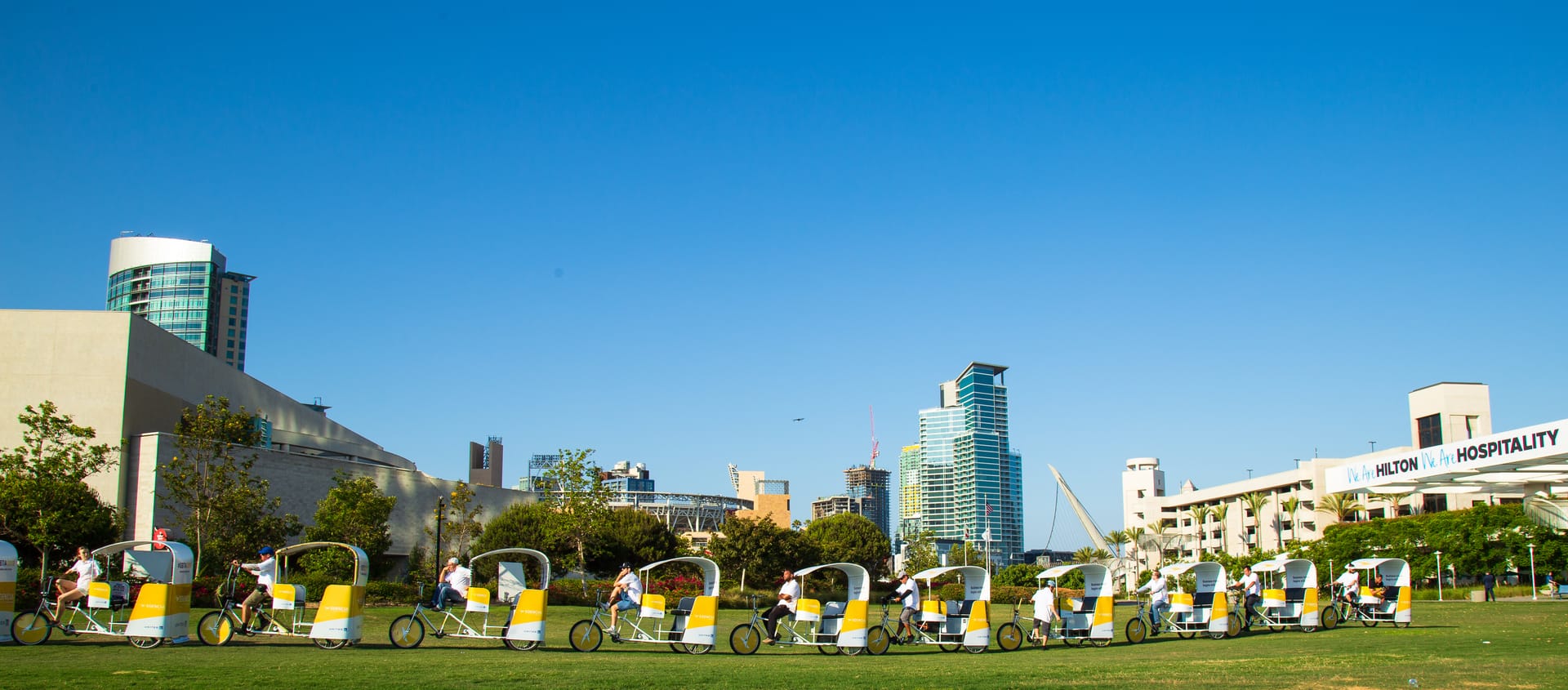 Hilton branded pedicab fleet with the San Diego downtown skyline