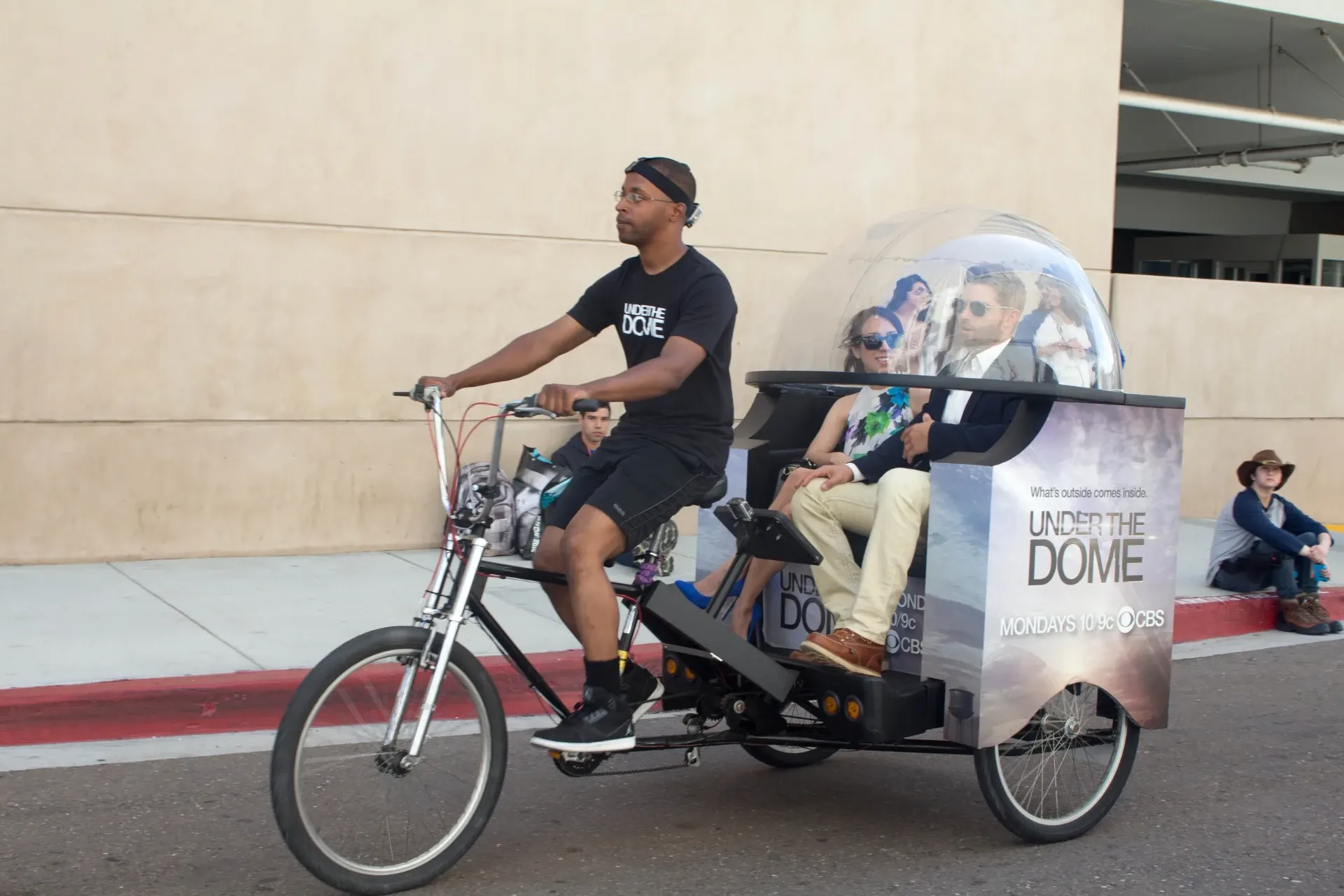 Under the Dome CBS custom dome pedicab with driver near convention center Comic-Con